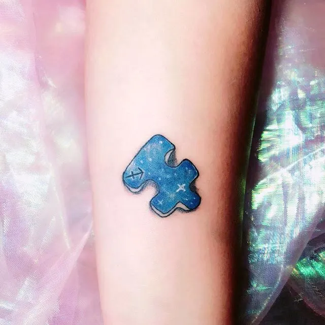 The puzzle piece tattoo for Sagittarius by @erika_jyo