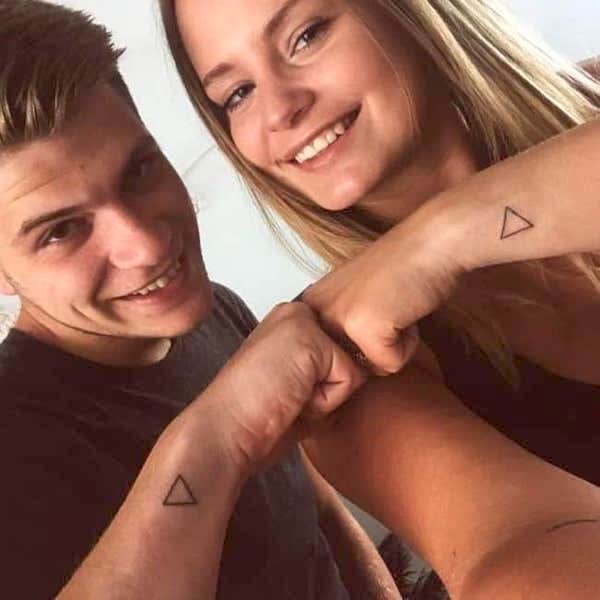 Matching triangle tattoos for couples by @lauradebruyn