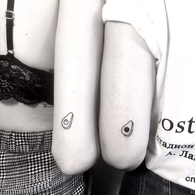 Adorable avocado matching tattoos for friends by @niebuhr_tattoo