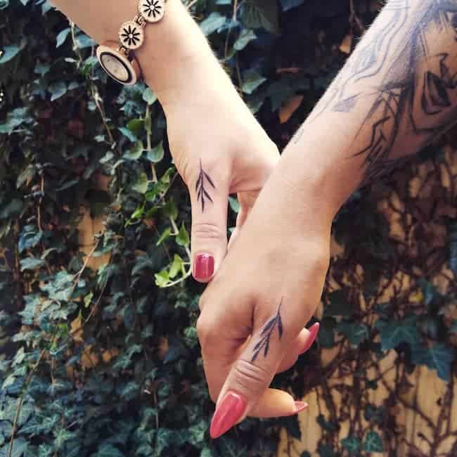 Herbal matching thumb tattoos by @heksa.handpok