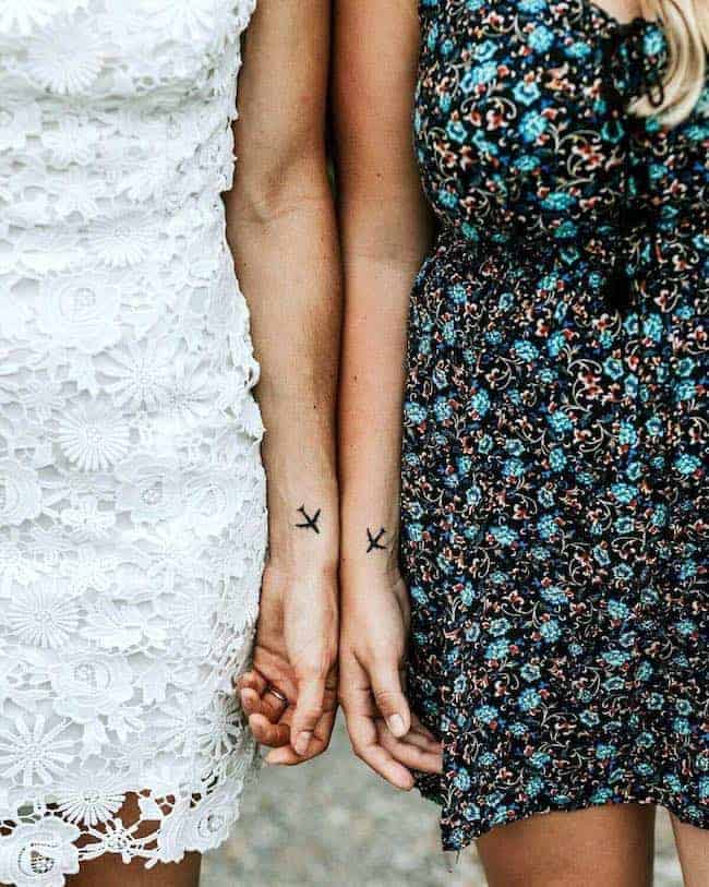 Matching plane tattoos for long distance best friends by @scubamandy100