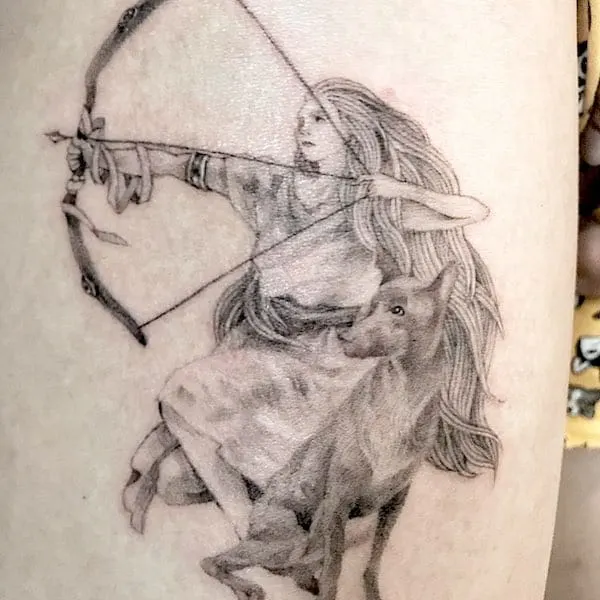 A realistic archer tattoo by @anneauxtattoo - Creative Sagittarius zodiac tattoo ideas