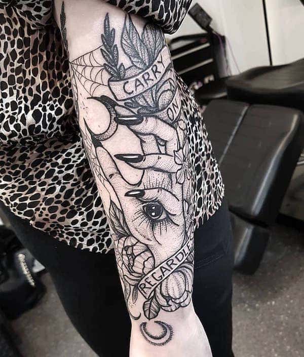 A dark forearm witchy Hamsa tattoo by @bexpriesttattoos - Wicca symbol tattoos