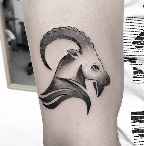 An abstract Sea-Goat leg tattoo by @debbie.tattoo