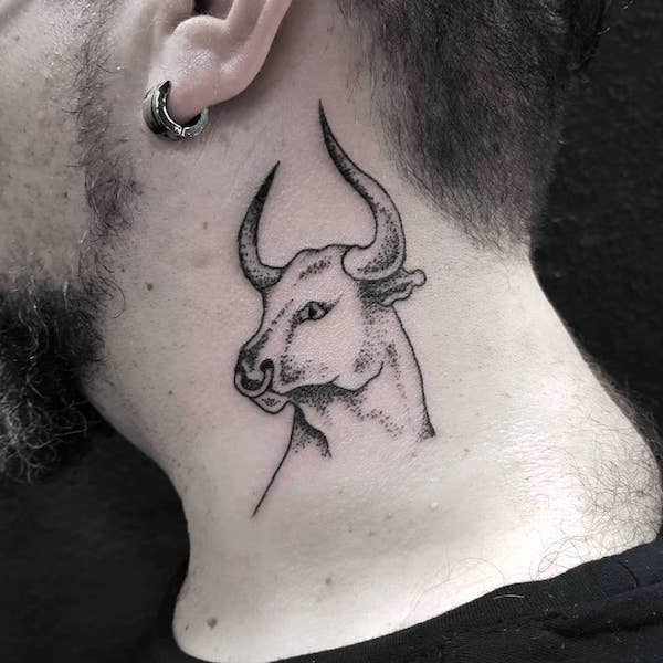 A bull on the neck by @erez_adato_  - Bold Taurus tattoos for men