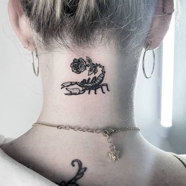 A blackwork neck tattoo by @itattpeople - Scorpio tattoos for women that are pure dark aesthetics