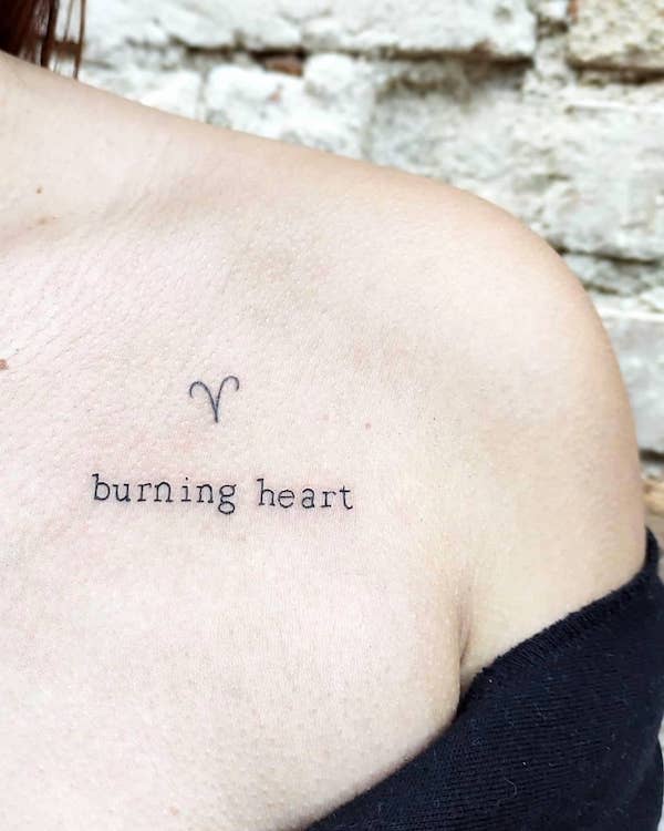 Burning heart collarbone tattoo with the Aries symbol by @josyfabres
