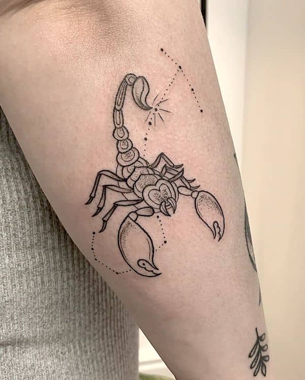 A small outline tattoo with a stars background by @sophieelizabethtattoo - Scorpio tattoos for women