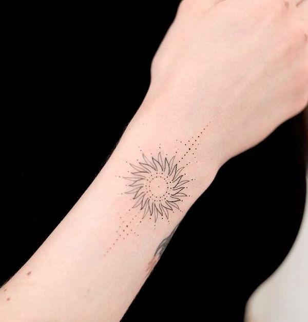 A sun tattoo on the wrist - the Sun. ruling planet of Leo by @vadersdye