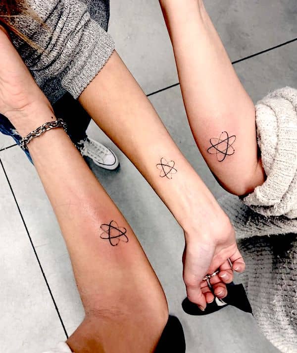 Atomic orbit symbol tattoos for 3 by @herutuval- Stunning unisex matching tattoos for siblings
