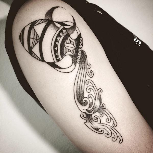 A tribal Water Bearer sleeve tattoo by @mositvrv