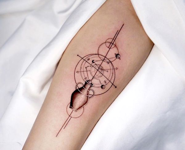 A compass tattoo with Aquarius constellation and the vessel by @dan_tattooer