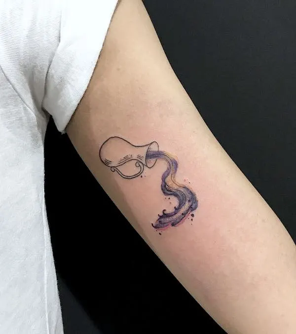 A cute bicep tattoo for Aquarius women by @ferdylawless