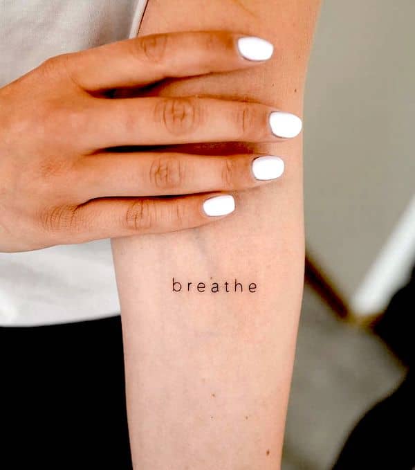 “Breathe” - a one-word quote tattoo to keep you grounded by @minustattoo