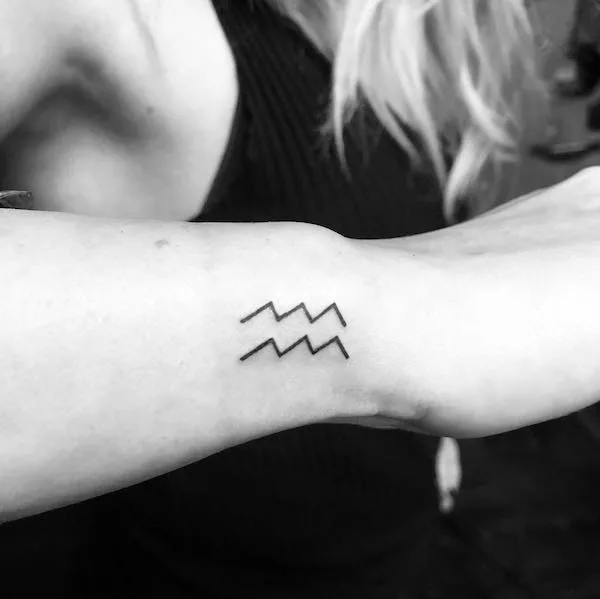 A minimalist wrist tattoo for Aquarius women by @yaseminkarakaya
