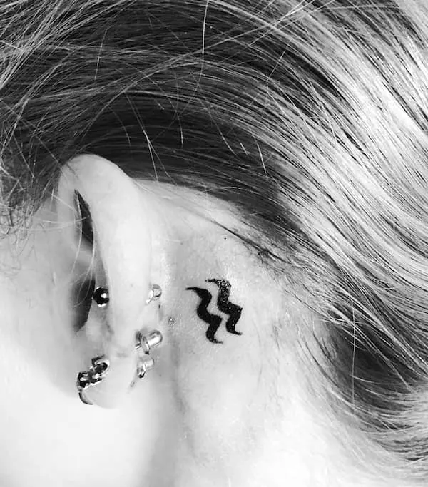 A dainty behind-the-ear tattoo that is easy to hide by @claire_duke