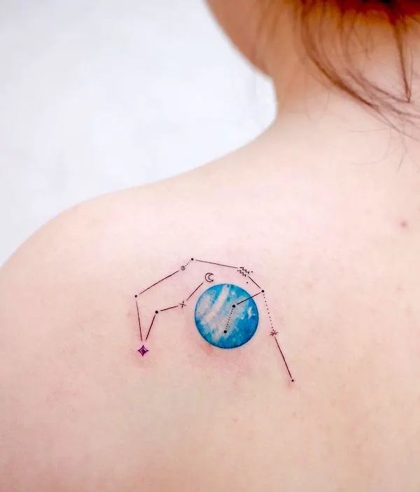 A Saturn tattoo with Aquarius constellation on the shoulder blade by @donghwa_tattoo