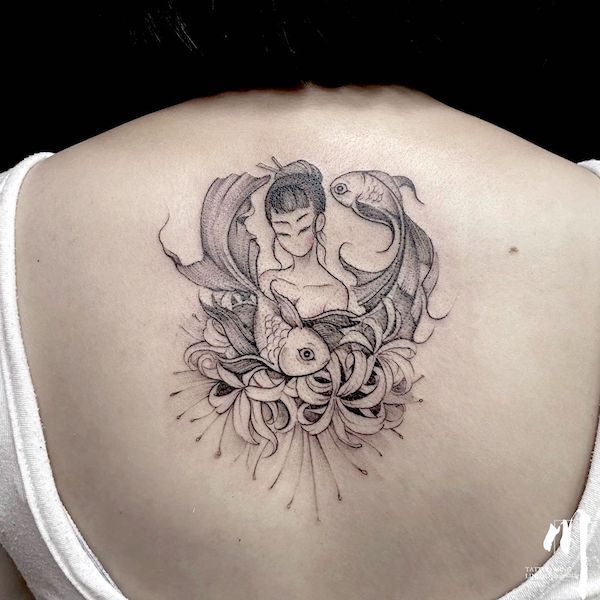 A dreamy fish girl back tattoo for Pisces women by @tattooming1- Fish tattoos to showcase your Pisces pride