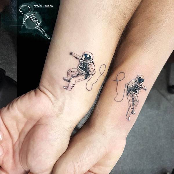 The attached astronauts tattoos by @orcnyalcn- Stunning unisex matching tattoos for siblings