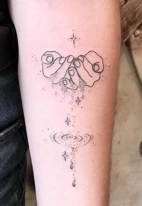 Hands holding water - a sleek tattoo with a story to tell by @averykiyo