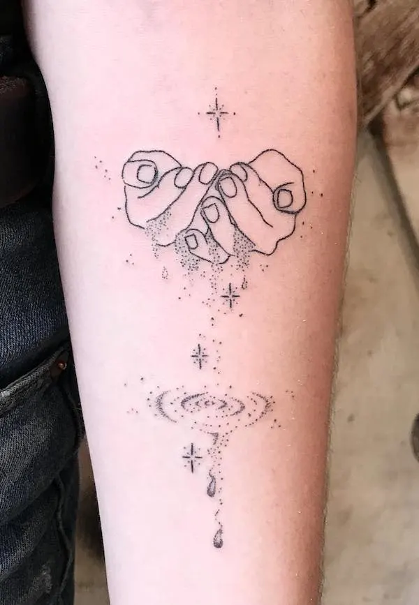 Hands holding water - a sleek tattoo with a story to tell by @averykiyo