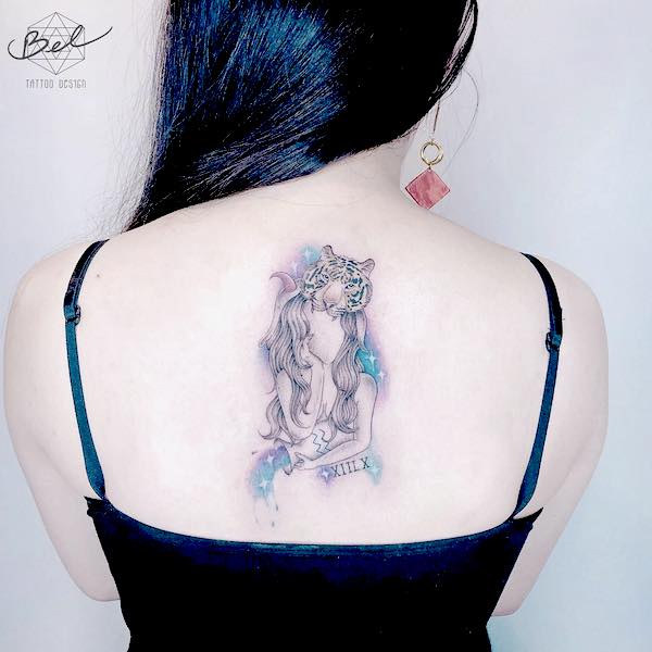 A back tattoo that reveals the fierce side of Aquarian by @bel_tattoo