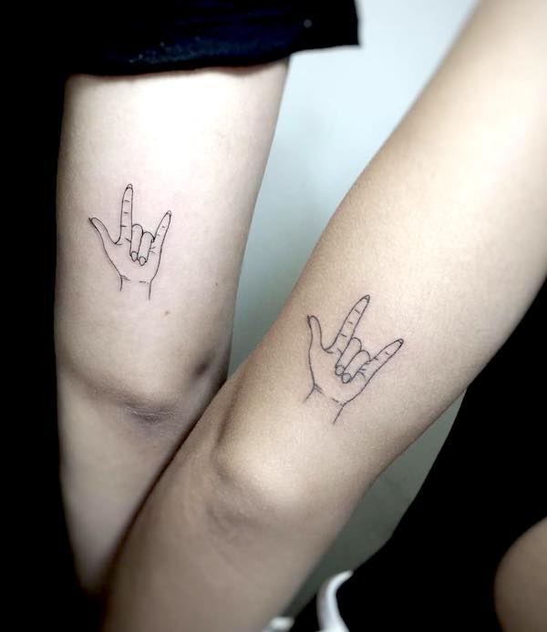 Sign of the horns tattoos with an attitude by @cafox- Stunning unisex matching tattoos for siblings