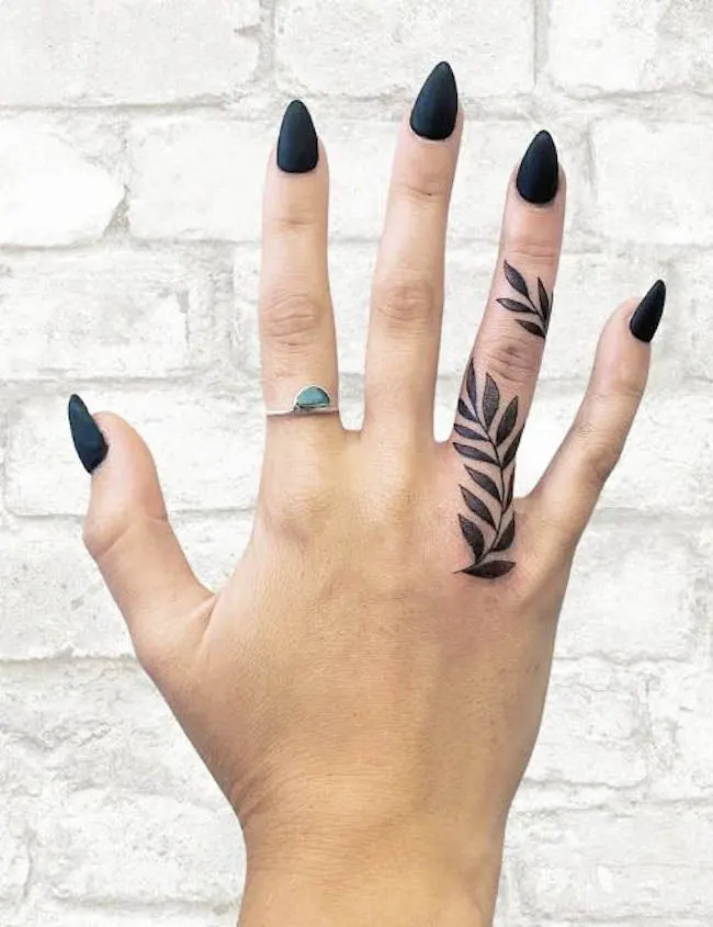 A vine tattoo on the ring finger by @bamtattoos - Bold statement finger tattoos