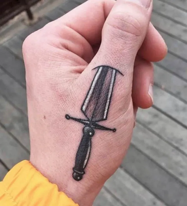 A unique dagger tattoo by @ghettoninjatattoo- Creative thumb tattoos
