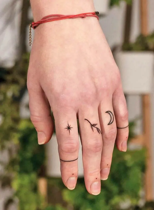 Natural elements tattoos by @inkedlodz - Bold statement finger tattoos