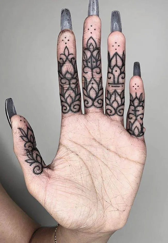 MMehndi tattoos on the palm by @inkmindcrew - Bold statement finger tattoos