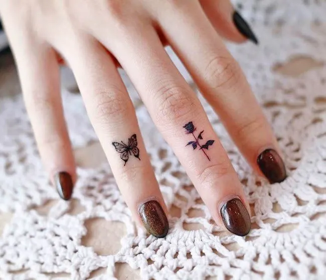 Elegant dark rose tattoo by @onyx_gil- Dainty finger tattoo ideas