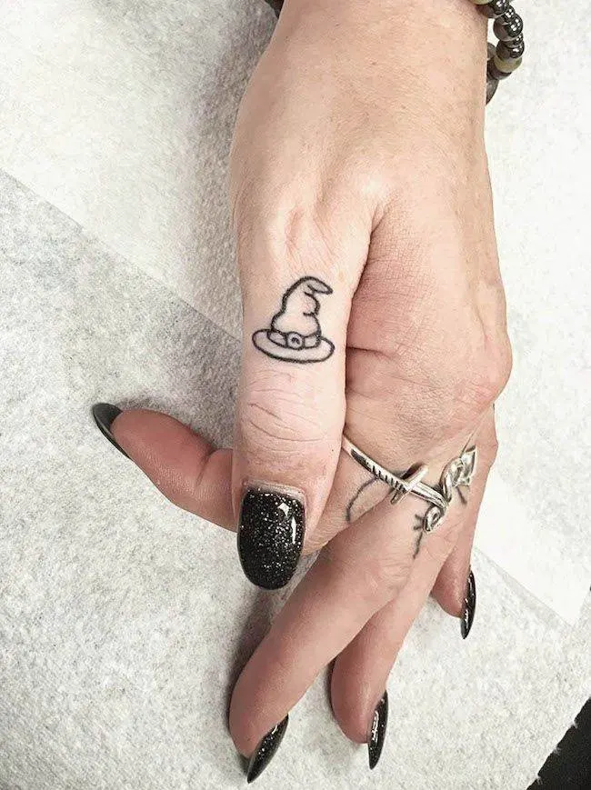 A witch hat thumb tattoo by @sara_scribbles- Creative thumb tattoos