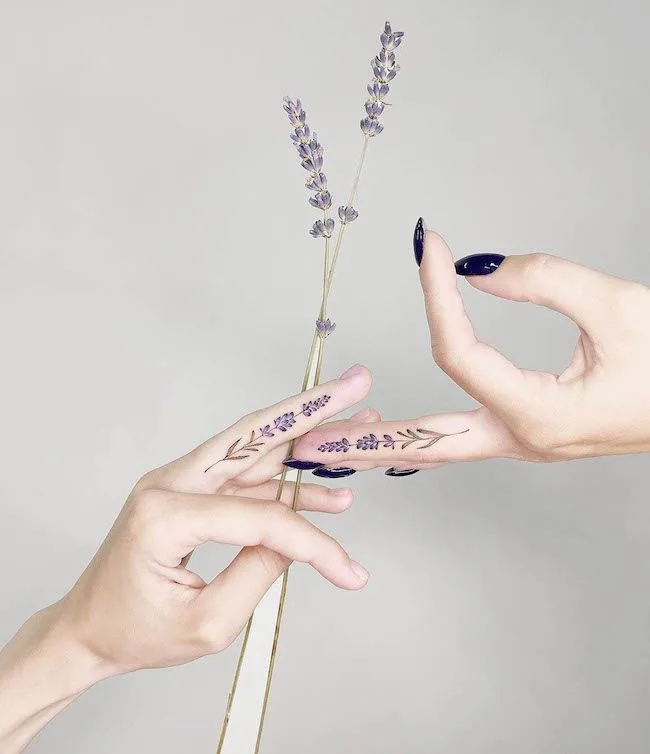 Matching lavender tattoos by @tattoo.bloom - Matching finger tattoos for couples