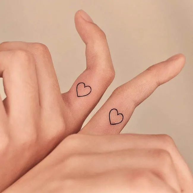 Cute heart inner finger tattoos by @tattooer_jina - Matching finger tattoos for couples