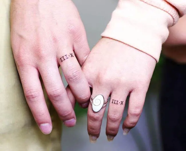 Matching number tattoos by @tayyy_carter - Matching finger tattoos for couples