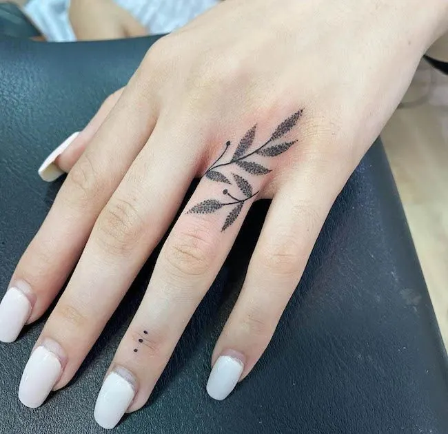 A dotwork vine tattoo by @vivislm - Bold statement finger tattoos