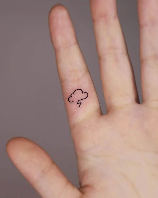 A dainty storm finger tattoo by @yoyo_tattoo- Dainty finger tattoo ideas