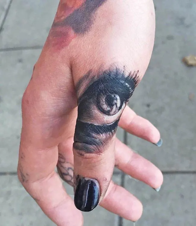 A realistic eye tattoo by @zach_brunner- Creative thumb tattoos