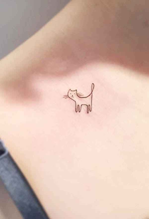 A simple cat outline tattoo by @playground_tat2