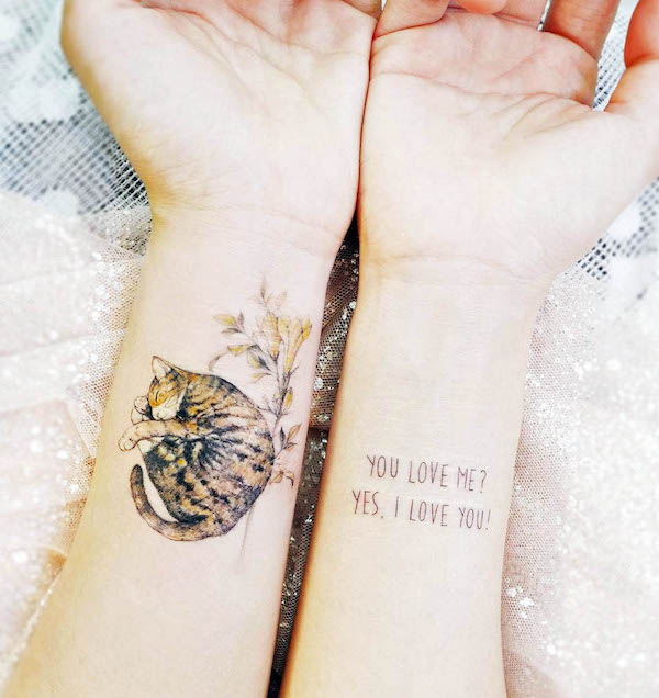 A sleeping cat tattoo on the wrist by @tattooist_banul - Stunning realistic cat tattoos