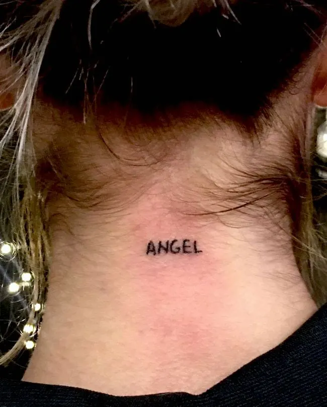 Angel - A tiny behind-the-neck tattoo by @carpenter_tattoo