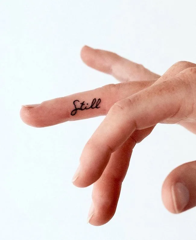 Finding stillness in chaos - a tiny finger tattoo by @chloejanetattoos