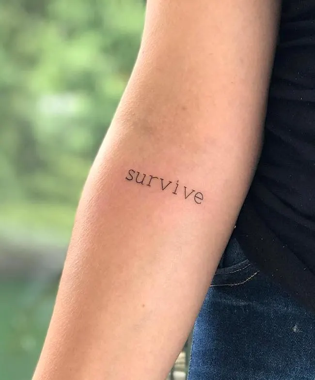 A word tattoo for survivors by @doggstattoo