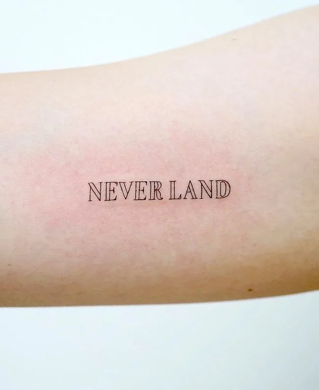 Neverland - dreamy word tattoo by @hktattoo_tina