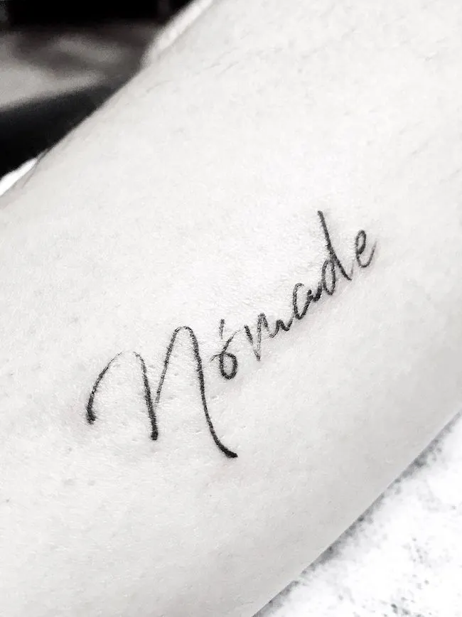 Nomade by @ink_details - a word tattoo for the explorers of life