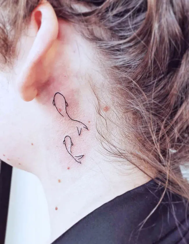 A minimalist one-line fish tattoo to show or hide - Pisces tattoo by @sleeinkstudio