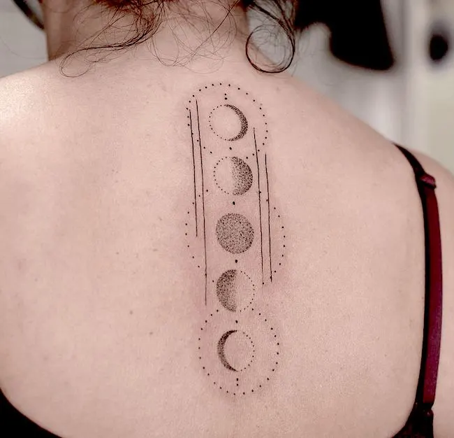 A geometric moon phase tattoo by @ladyshenone