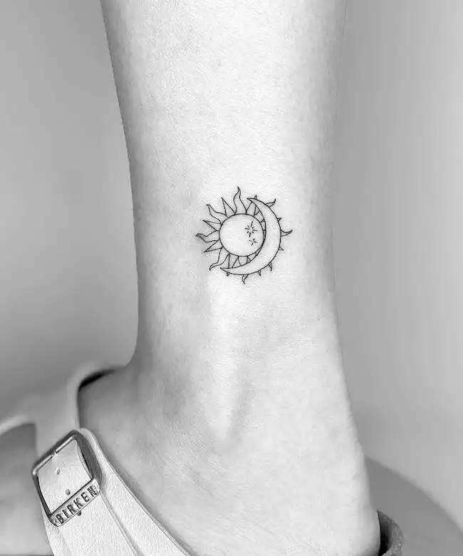 A simple sun and moon ankle tattoo by @cagridurmaz