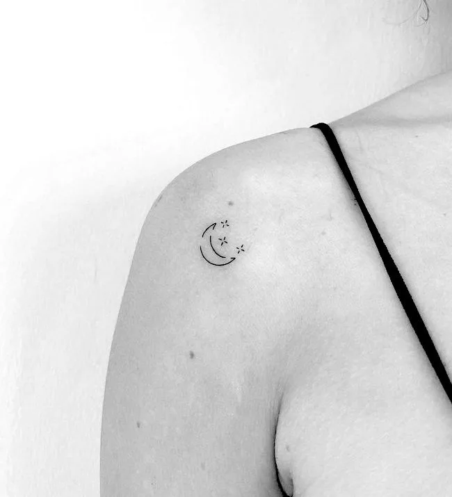 A small moon and stars tattoo on the shoulder by @cagridurmaz